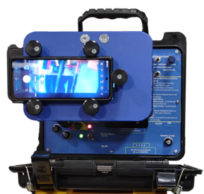 A blue plate with knobs holding a cell phone is attached to a Chim-Scan® Series 100 controller. On the reverse side of the plate is a box that buts up against the controller monitor for taking images and videos of chimney defects with a cell phone. 