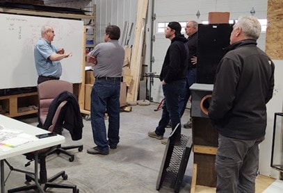 Tom Urban is teaching a class on chimney inspections at the Chim-Scan® lab in Iowa.