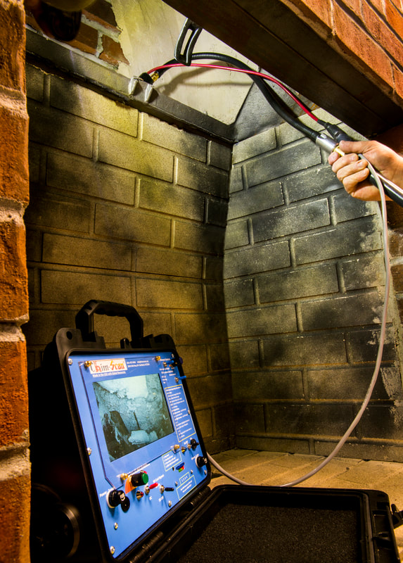 A Chim-Scan® monitor shows the view of a smoke shelf as a flexible Gooneck Rod and Enviro Camera scan.