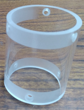 A J3D™ clear acrylic lens cover cylinder has predrilled holes for attaching to the camera.