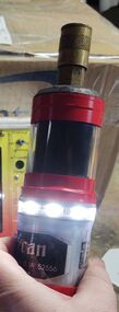 A cylindrical chimney camera with bright LED lights.